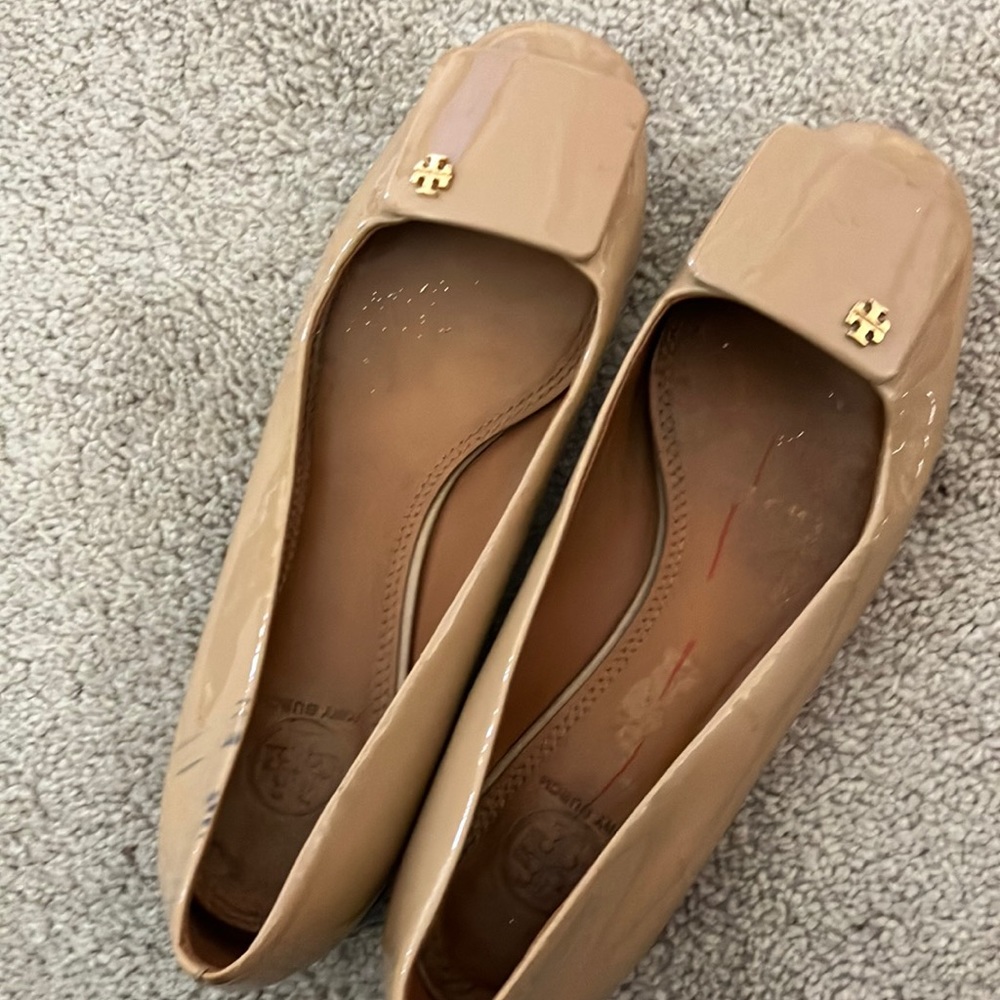 Tory Burch flats with lots of wear left.